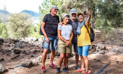 older adults posing for photo outside
