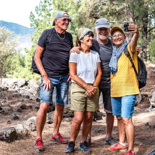 older adults posing for photo outside