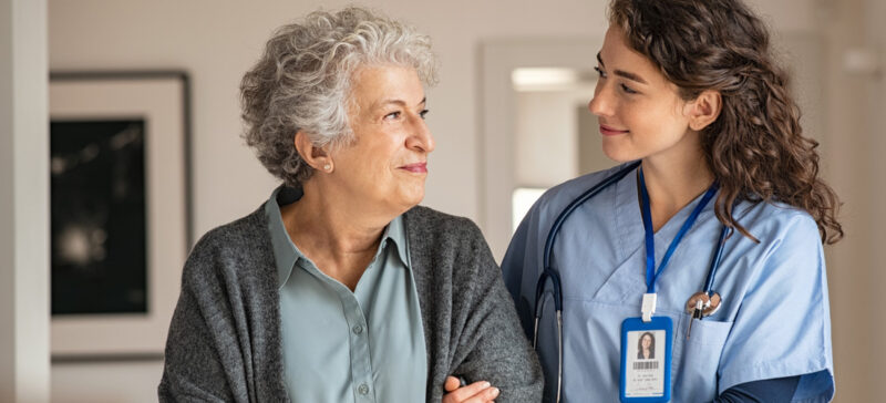 older adult woman with healthcare worker